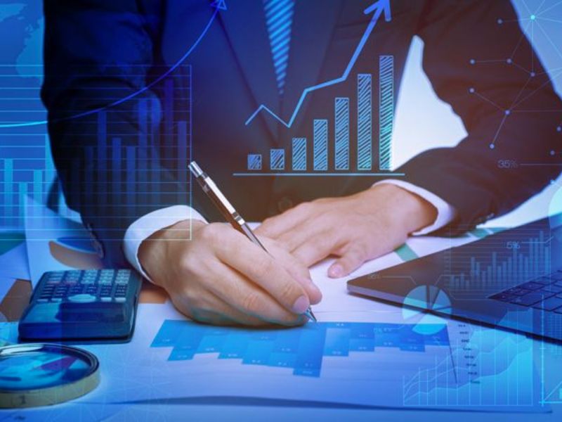 If an employee of a converted public service unit commits to working long-term for the joint stock company, how many additional shares can they buy?