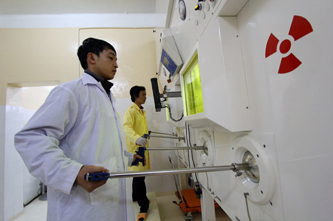 What conditions are required to be granted a license to carry out radiation work and import radioactive sources?